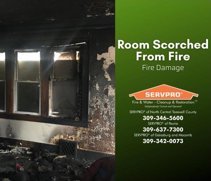 A room is badly damaged from fire and smoke