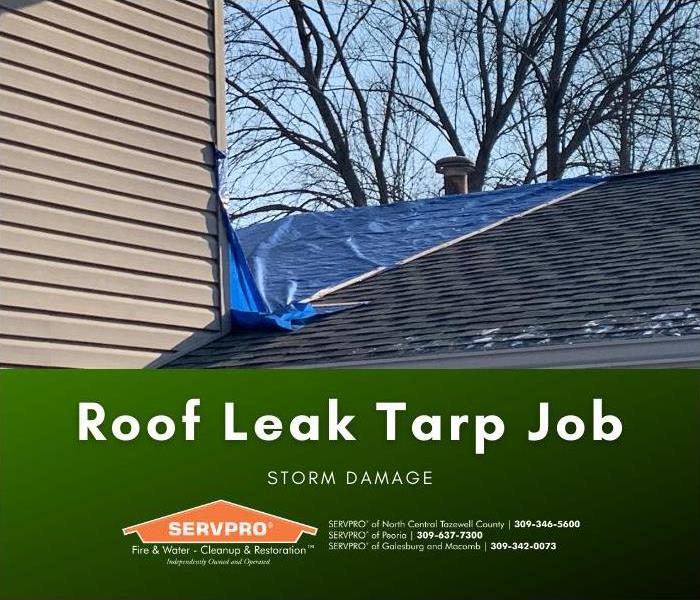 Tarp placed on roof to prevent further damage during cleanup and restoration.