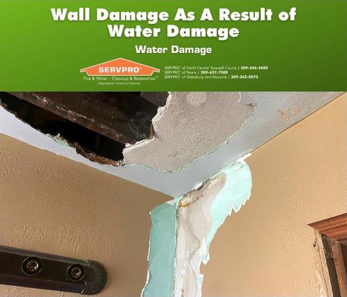 Wall damaged in upper corner area after water damage.