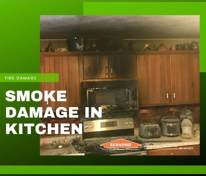 Fire caused thick smoke and soot damage in a residential kitchen over the stove on the microwave and ceiling