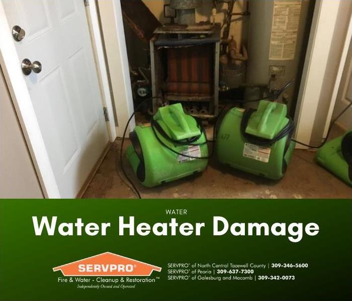 Air movers placed to dry water heater water damage